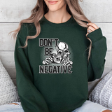 Don't Be Negative Skull Camera Sweatshirt