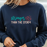 Crewneck Sweatshirt — "Stronger Than The Storm" Inspirational Heart Design